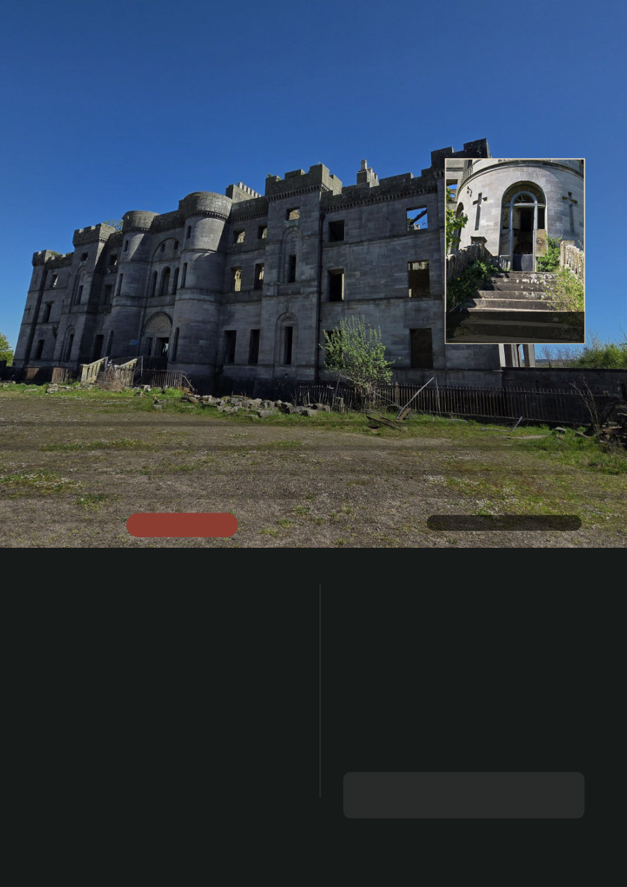 A vast roofless Scottish castle beneath a blue sky